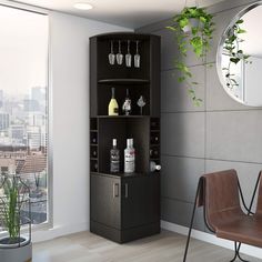 a corner cabinet with bottles and glasses on it next to a chair in front of a window