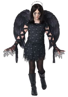 a woman dressed as an angel with black wings and polka dots on her body,