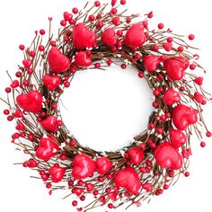 a wreath with red hearts on it and some branches around the perimeter, all arranged in a circle