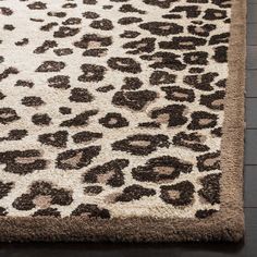 a leopard print rug on a wooden floor