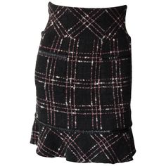 Chanel High-Waisted Black, White and Pink Plaid Skirt Plaid and tweed mini skirt. High waisted fit with ruffle at the bottom. Very "Cher" from Clueless vibes. Silk Lined. Zipper in the back. Size 34 Pink Plaid Skirt, Chanel Skirt, Gold Skirt, White Maxi Skirts, Wool Mini Skirt, Boucle Jacket, Tweed Mini Skirt, Black Tweed, Vintage Rock