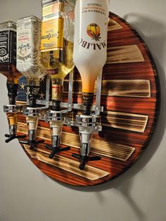 a wall mounted beer dispenser filled with liquor