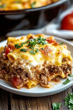 a close up of a plate of lasagna casserole on a table