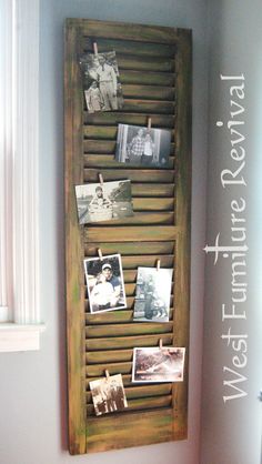 a wooden shutter with pictures hanging on it