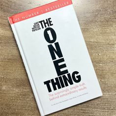 the one thing book sitting on top of a wooden table