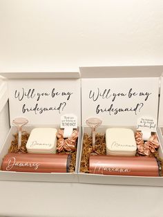 two bridesmaid gift boxes with chocolates in them