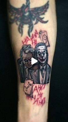 the joker and clown tattoo is on someone's left leg, with words written in red ink