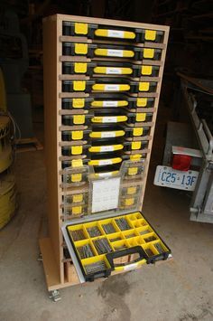 a large display case with many yellow and black items in it's trays