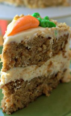 a slice of carrot cake on a green plate