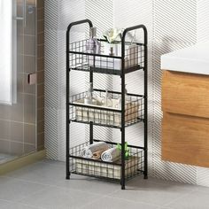 a bathroom shelf with baskets on it next to a sink