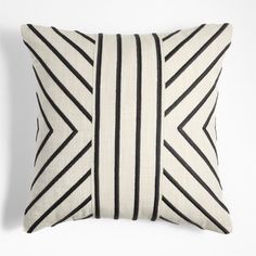 a black and white striped pillow on a white background