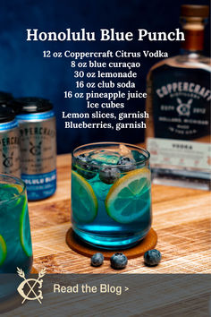 the blue punch is served with lemon slices and garnish