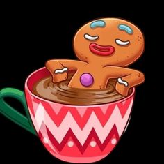 a ginger in a mug with eyes closed and one hand on the cup's side