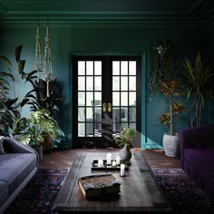 Black french doors in a living room with green walls, wood floors, purple furniture and hanging and potted plants. Turquoise Couch Living Room Decor, Turquoise Couch Living Room Ideas, Teal Couch Living Room, Teal Sofa Living Room, Turquoise Couch, Burnt Orange Living Room, Teal Rooms, Living Room Turquoise, Teal Living Rooms