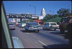 cars and trucks traveling down the highway in traffic