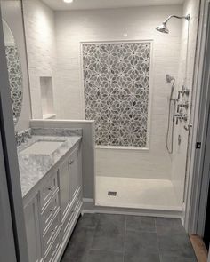 a bathroom with two sinks and a shower