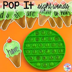 an ice cream cone with the words pop it in front of it, and some cupcakes next to it