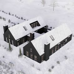 an aerial view of a black house in the middle of a snow covered field with evergreen trees