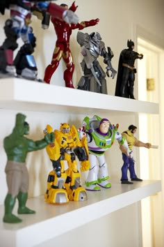 toy figurines are lined up on the shelves