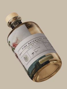 a bottle of wine with a label on the top and bottom, in front of a gray background