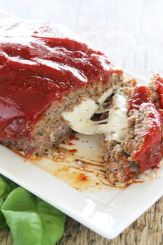 the meatloaf is covered with sauce and cheese