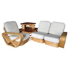 a set of three chairs and a coffee table