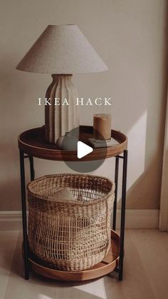 a table with two baskets on it and a lamp next to it that says ikea hack