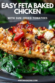 easy feta baked chicken with sun - dried tomatoes and spinach on a black plate