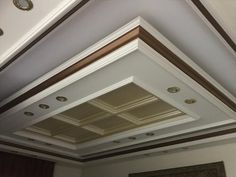 the ceiling in this room is painted white and brown