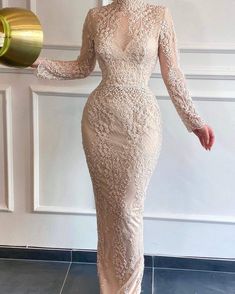 Charming Cream Evening Dress has a high neck and long net sleeves.