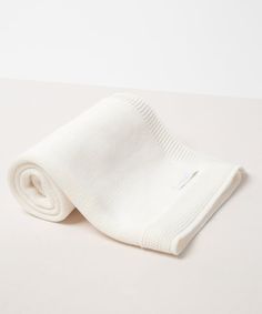 a white towel folded on top of a table