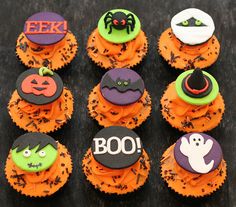 cupcakes decorated with icing and decorations for halloween