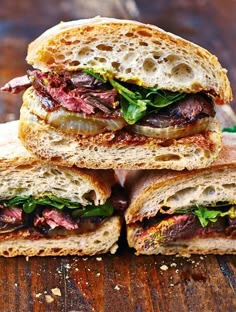 a close up of a sandwich with meat and vegetables