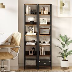 a room with a chair, desk and bookshelf