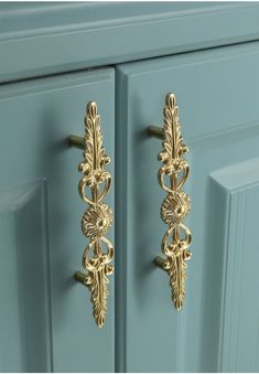 an image of a door handle on a blue cabinet