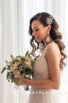 a woman in a wedding dress holding a bouquet