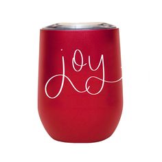 a red wine tumbler with the word joy written on it