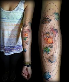 two people with tattoos on their arms