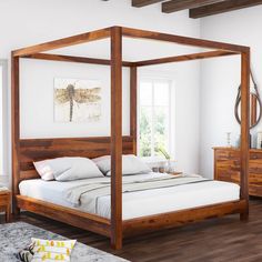 a bed with four posts and white sheets in a room next to a wooden dresser