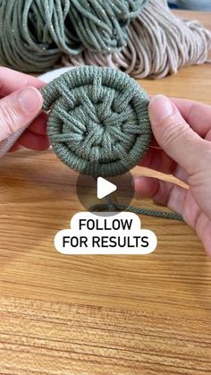 two hands are holding yarn on top of a wooden table with the words follow for results