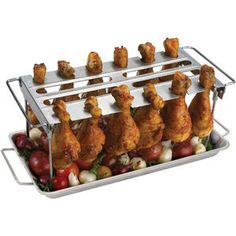 chicken legs on a rack with apples and cherries in the bottom right hand corner