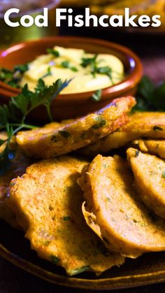 some fried food on a plate with dipping sauce