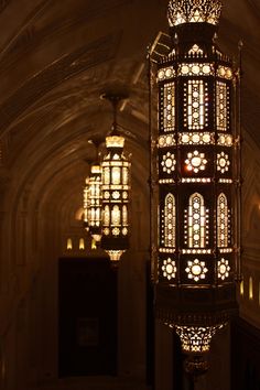 an ornate chandelier hanging from the ceiling in a building