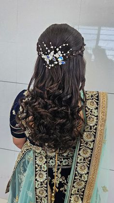 the back of a woman's head wearing a bridal hair piece