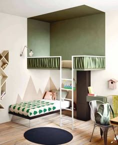 a bedroom with bunk beds, desks and shelves on the wall next to each other