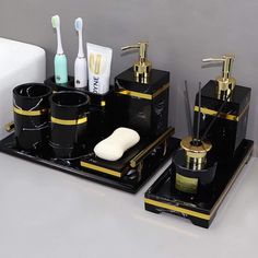 black and gold bathroom accessories with toothbrush holder