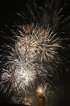 fireworks are lit up in the night sky