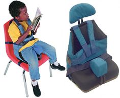 a young boy sitting in a chair reading a book next to a backpack with the seat up