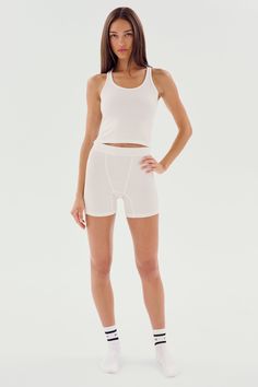 A cropped version of our fabulous Ashby tank. Super soft baby rib fabric hugs your body and layers effortlessly. BEST FOR: running, yoga, CrossFit, barre, Pilates, spin class, cycling and gym workouts. Sporty Crop Top With Built-in Shorts For Gym, Athleisure Yoga Top With Short Shape, Sporty Short Length Yoga Tops, Sporty Short Top For Yoga, Sporty Short Yoga Tops, Athleisure Yoga Tops Short Length, White Fitted Crop Top With Moisture-wicking, Compressive Summer Tank Crop Top, Athleisure Crop Top With Minimal Stretch For Workout