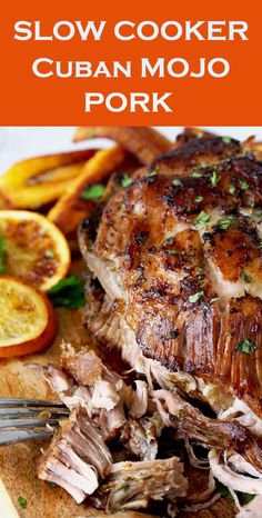 slow cooker cuban mojo pork on a cutting board with orange slices and parsley